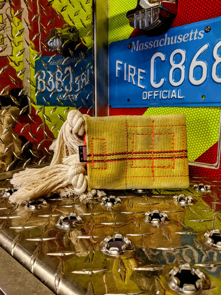 Firehose chew toy with rope tassels