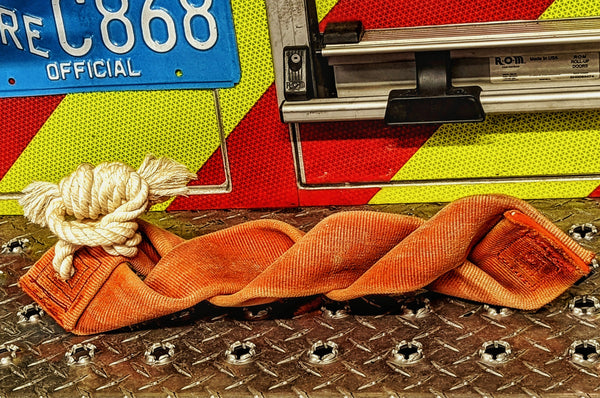 Fire hose braided tug with cotton rope handle made from 100% real up-cycled repurposed fire hose