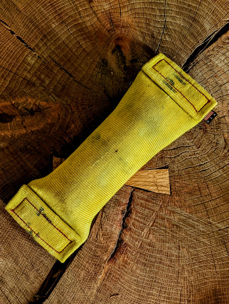 Heavy-duty water bottle-filled dog toy made from 100% real repurposed and recycled fire hose. Stimulating Upcycled, tough, and durable.