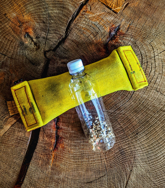 Heavy-duty water bottle-filled dog toy without rope tassels made from 100% real repurposed and recycled fire hose. Stimulating Upcycled, tough, and durable.