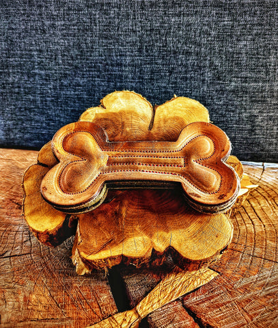 Heavy-duty Bone-shaped chew toy (Rawhide alternative) made from natural leather and wool felt. Laser cut and hand-stitched