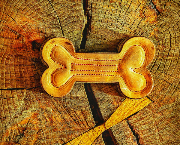 Heavy-duty Bone-shaped chew toy (Rawhide alternative) made from natural leather and wool felt. Laser cut and hand-stitched