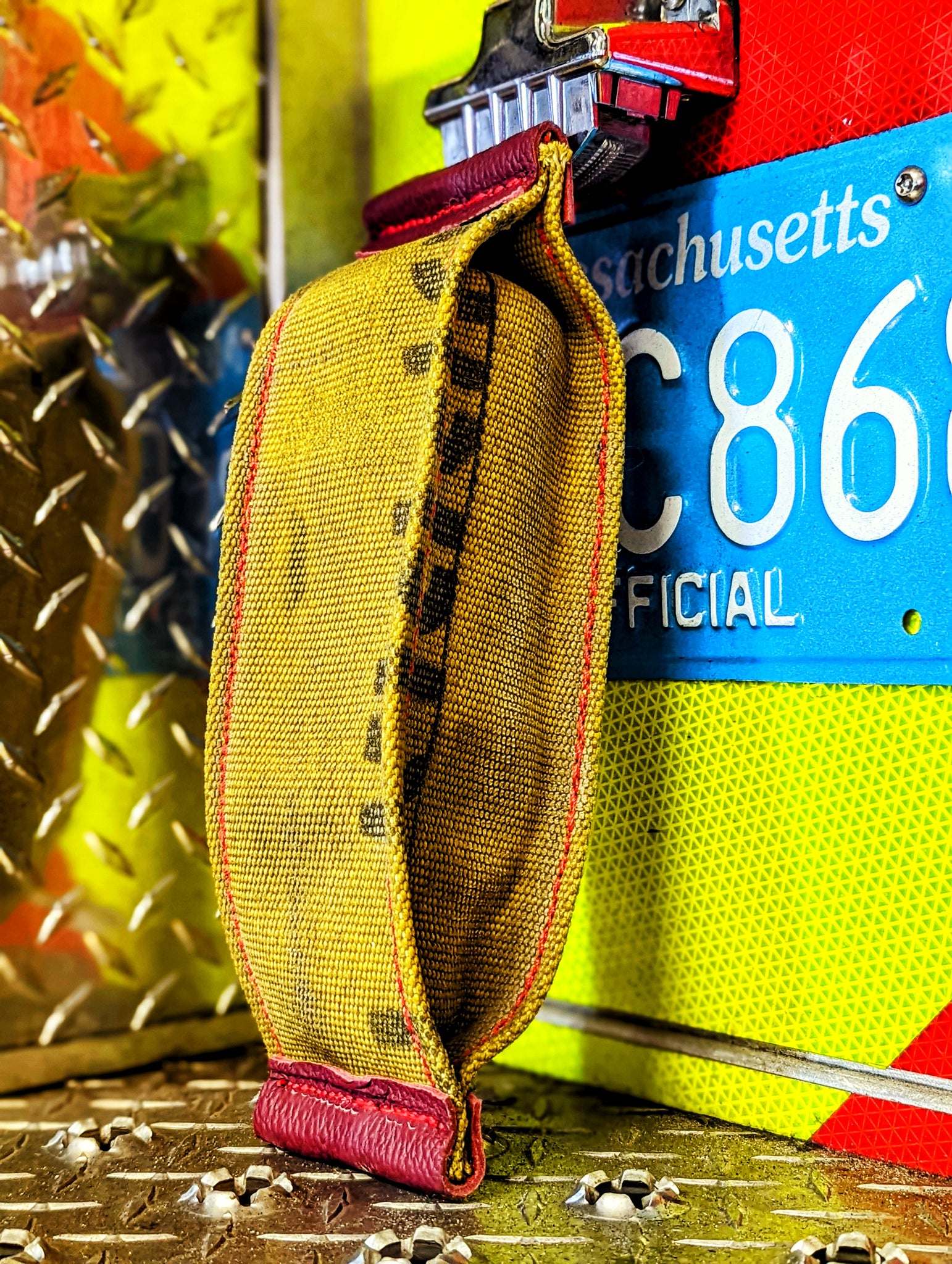 Interactive fire hose dog toy with (crinkly dry bean filled water